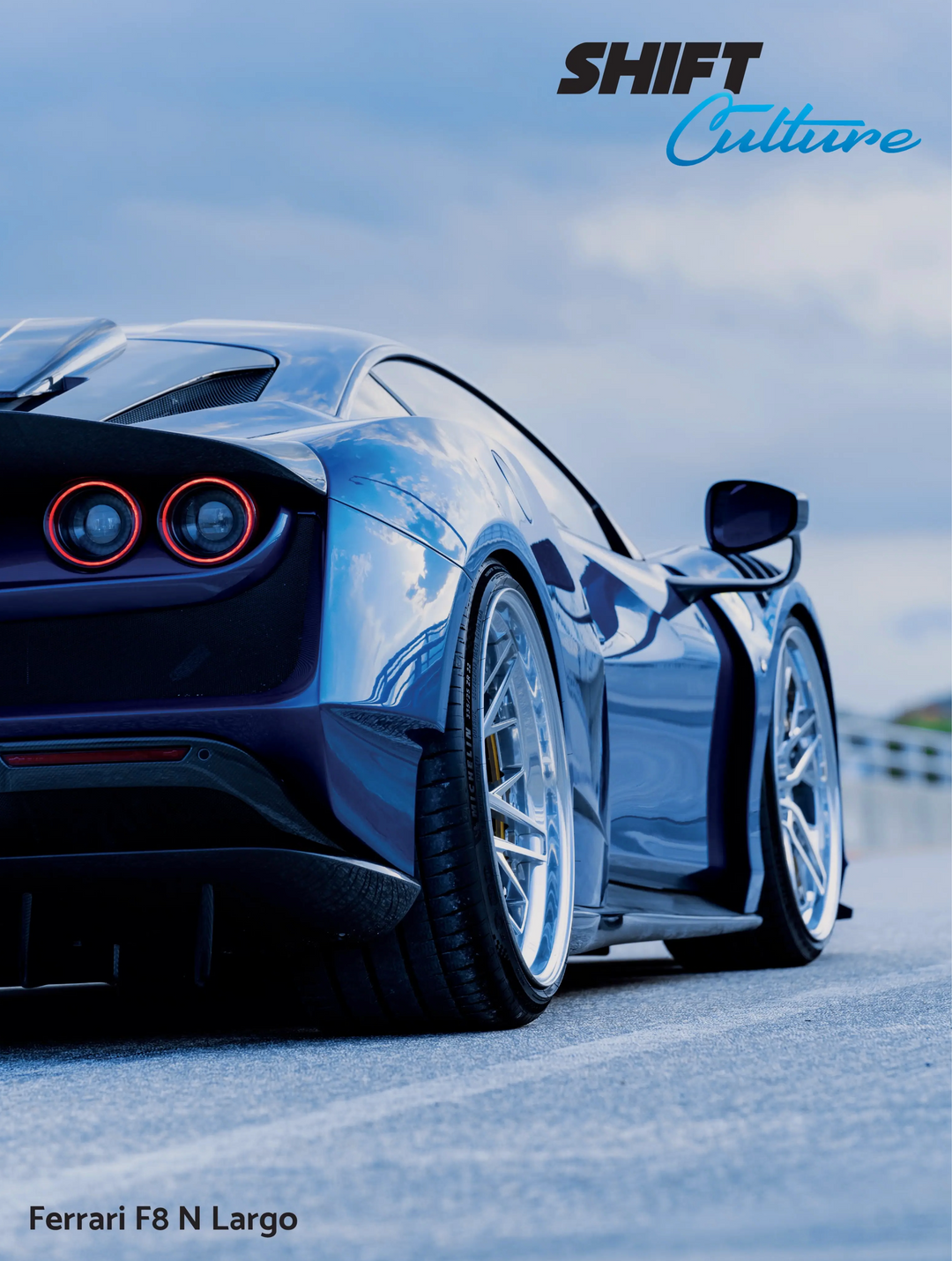 Blue Ferrari F8 N Largo rear view on a road with 'SHIFT Culture' branding.