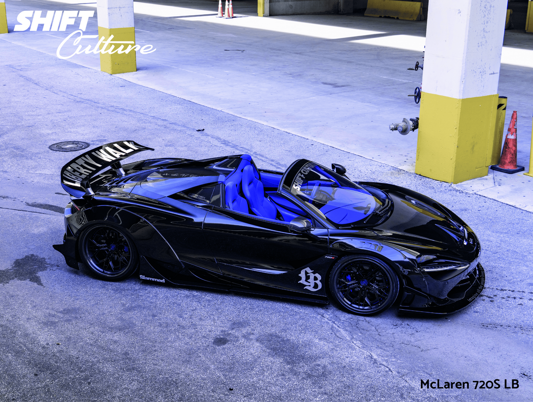 Black McLaren car on a track with visible branding