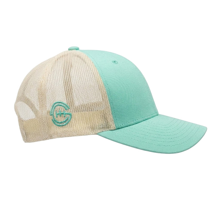 Side view of Shift Culture mint green and cream mesh back hat with mint SC gear logo embroidered on side panel