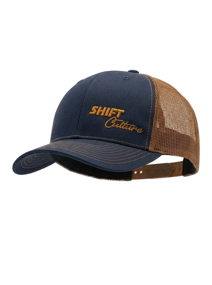 Navy and brown mesh Shift Culture hat with gold embroidered front logo and curved brim
